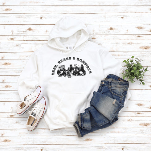 Introducing our hilarious "Beer, Bears & Bonfires" hoodie! Picture this: a couple of camping bears enjoying a cold one in the woods, gathered around a crackling bonfire. These fun-loving bears know how to have a good time, and now you can join in on the fun too!